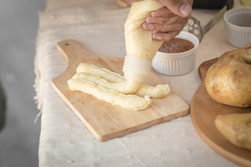 Mashed potatoes in a plate on a wooden table