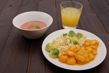 Pumpkin sauce and beans with bulgur on a table