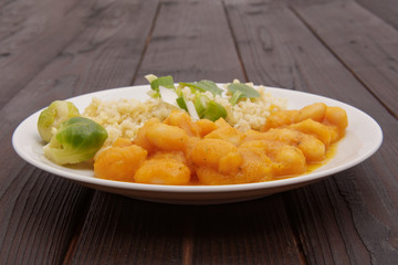 Pumpkin sauce and beans with bulgur on a table