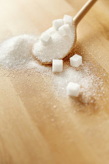 Fototapeta na wymiar Close Up Of White Sugar In Spoon On Table.