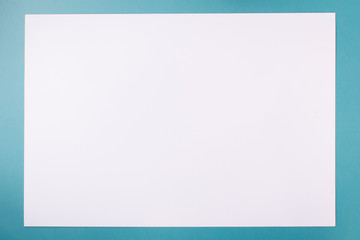 Empty white paper on blue background