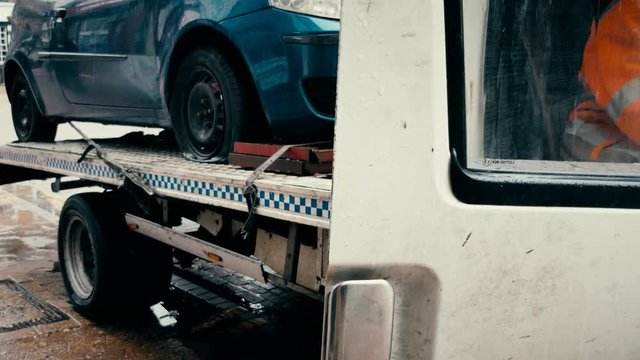 Crashed car in a tow truck.