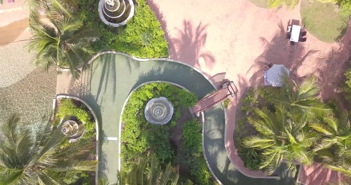 Birds eye view of poolside patio and garden in the Malaysian tropics