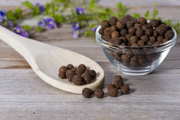 Close up on spoon with allspice (pimento)