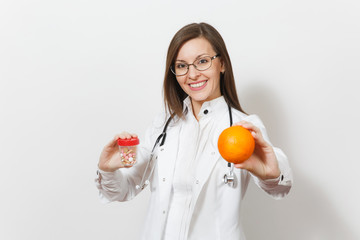 Smiling confident young doctor woman with stethoscope, glasses isolated on white background. Female doctor in medical gown holds bottle with pills, orange. Healthcare personnel, medicine concept.