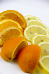 fresh fruits. Lemons and oranges sliced and whole