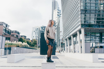 Young beautiful caucasian purple grey hair woman outdoor in the city having fun looking camera - happiness, freedom, dancing concept