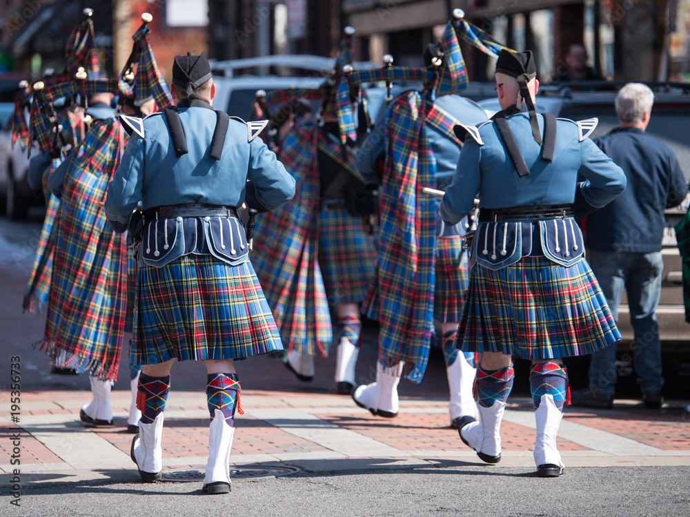 Wall mural saint patrick holiday parade. men in traditional irish kilt. awesome bagpipe players.