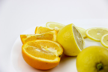 fresh fruits. Lemons and oranges sliced and whole