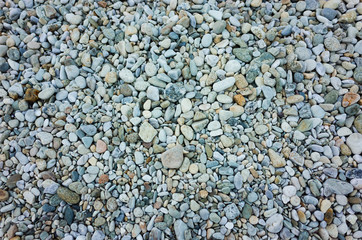 Texture of small ocean shore rocks and stones