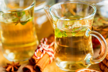 Herbal Christmas tea with honey and mint leaves