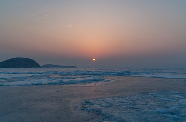 Sunset above iced sea