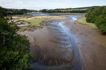View of river near seashore during the outflow reveals the mud and morass in Brittany - France