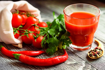 Glass of tomato juice with fresh tomatoes