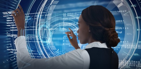 Composite image of side view of businesswoman using interface
