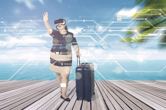 Obese woman wears VR glasses at pier