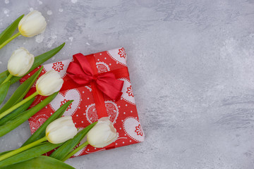 Greetings banner with white tulips and red gift box