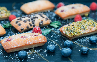 Vegan cakes decorated with mint and berries.