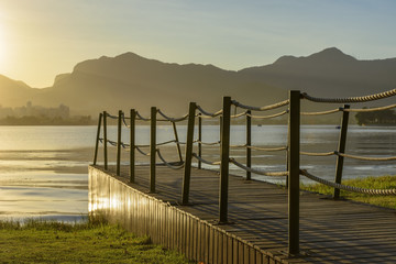 Image of the sunset at Rodrigo lagoon de Freitas in Rio de Janeiro with its mountains, pier and characteristic outline