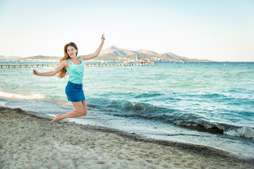 Young beautiful woman on beach