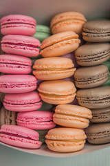 Colorful french macarons background, close up.Different colorful macaroons background.Tasty sweet color macaron,Bakery concept