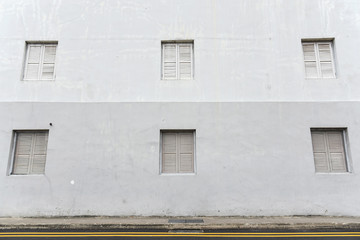 Windows with shutters on the wall