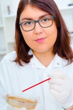Girl teen in the laboratory of food quality tests