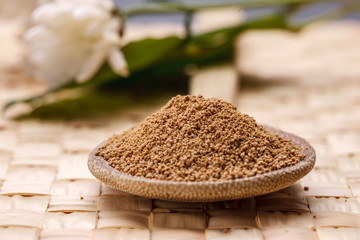 Macro of pure sugar on a spoon.