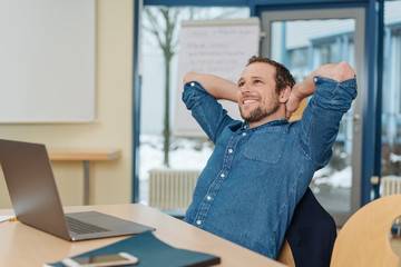 Happy businessman with a smile of satisfaction