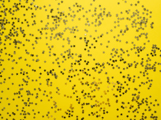 Yellow tape along the yellow background. Confetti star framing Copy space