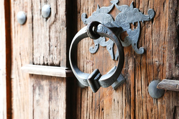 Background with wooden old Gothic door and door handle