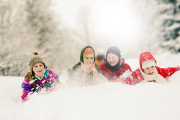 Group of happy children enjoying in winter