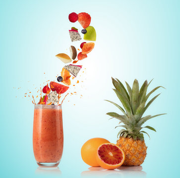 Smoothie drink with fruit flying ingredients