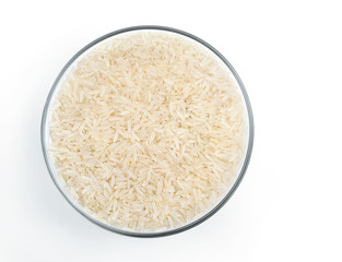 Healthy food. Parboiled rice in glass bowl isolated on white background. Top view. Copy space. High resolution product.