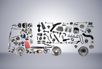 Images truck assembled from new spare parts on grey background. Truck with a trailer and with cargo
