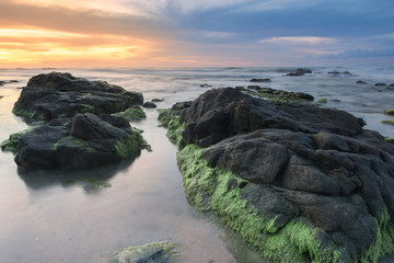 Fototapeta na wymiar seascape at the beach with natural coasltal rocks.