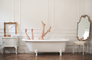 Girl having fun in the bathtub