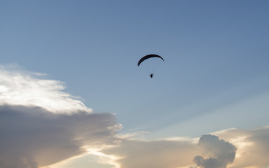 Paramotor, flying on a beautiful sky at sunset             