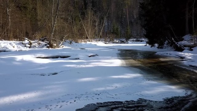 Winter walk along river drone