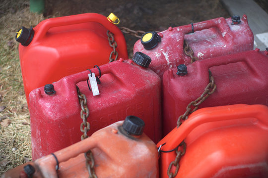 red plastic fuel containers flammable liquid gasoline petrol