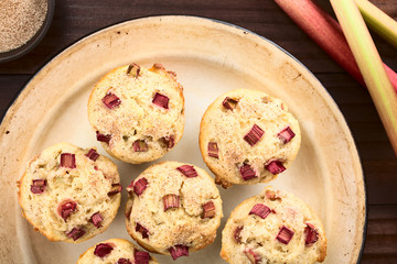 Fresh homemade rhubarb yogurt muffins sprinkled with cinnamon and sugar (Selective Focus, Focus on the top of the muffins)