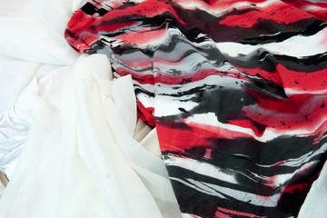 Red white and black colored crinceld fabric with spots