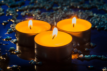 Single lit candles.Candles new year.