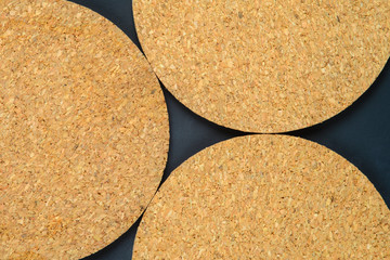 Cork drink coaster on dark blue background