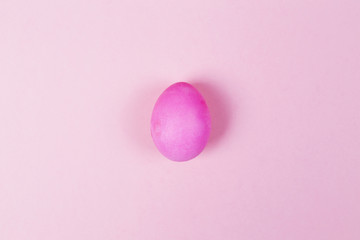 Pink egg on pink background. Top view