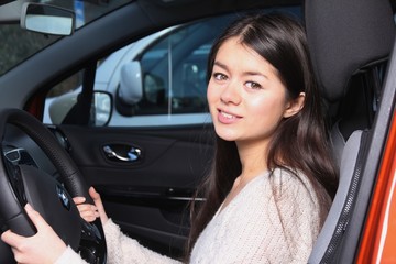 Asian woman in a car