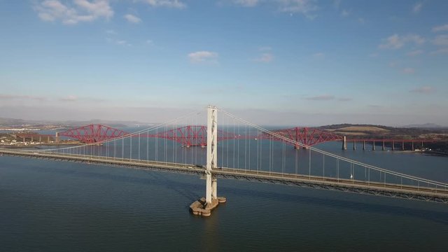 Aerial footage of the old Forth Road Bridge and the Railway Bridge.