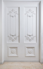 White wall decorated with classic fretwork
