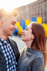 Couple spend time with each other, stand on the street and kiss
