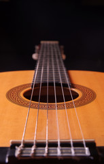 acoustic guitar on black background